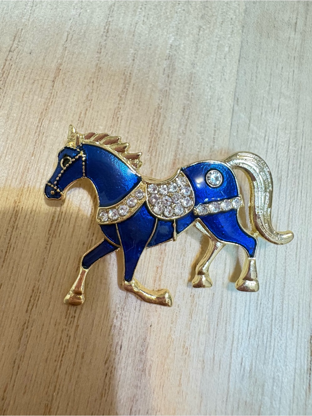 Gold-Tone Blue Horse Brooch with Crystal Accents